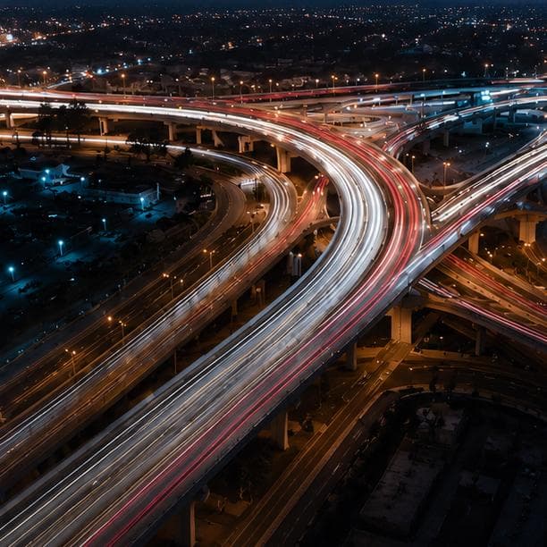 Dubai highway interchange with traffic at night
